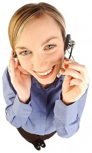Smiling woman talking into headset L uid 1269924